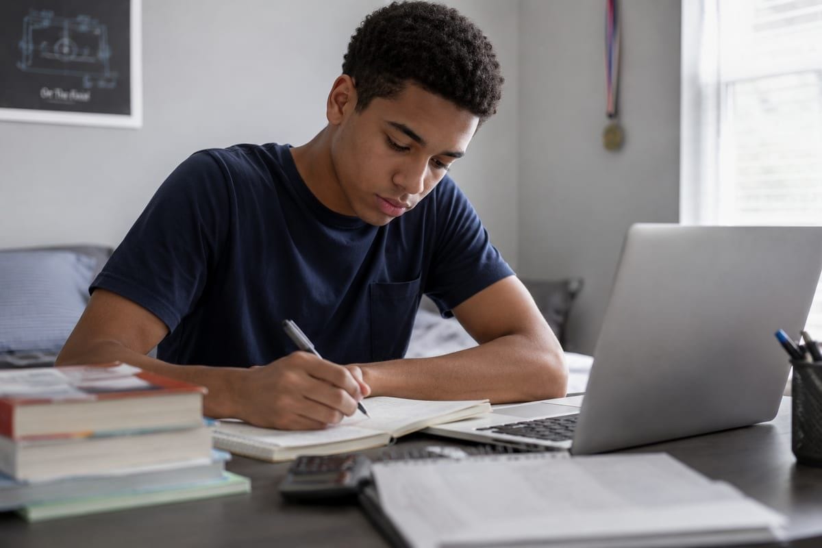 Young student in a focused 1:1 session with their tutor